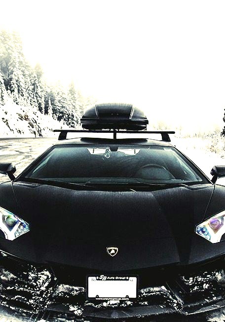 Always loved this color contrast. Black lambo on snow !